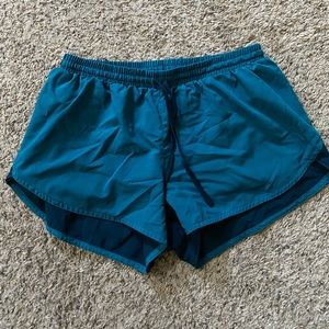 Teal running shorts